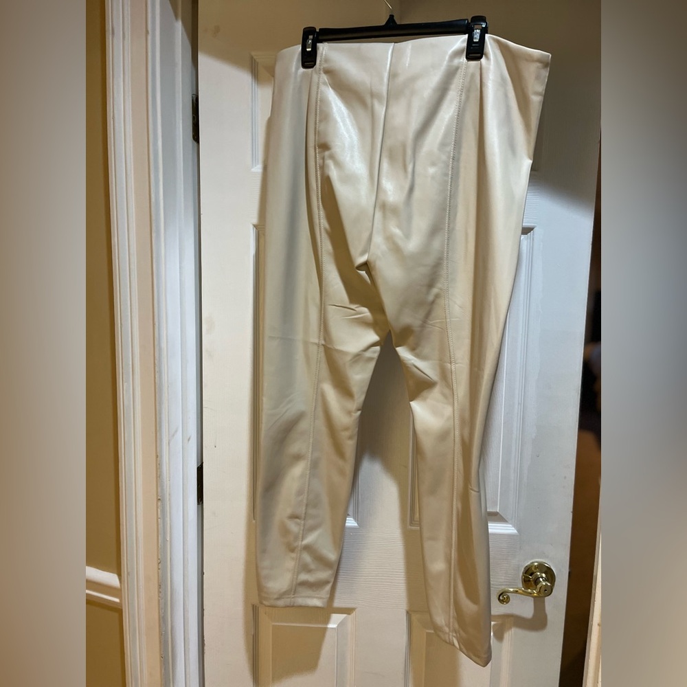 Nicole Miller, cream colored, faux leather pants, and never worn.